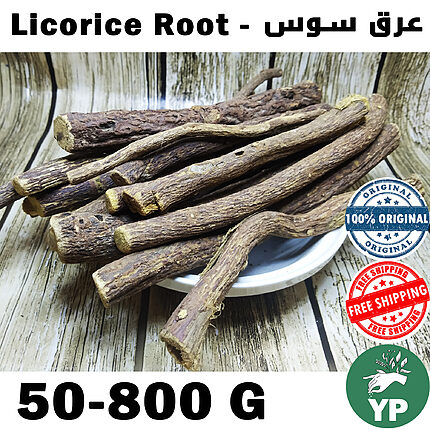 Whole dried Moroccan licorice root sticks piled on a white ceramic plate against a rustic wooden background, showing natural brown bark and golden cut ends