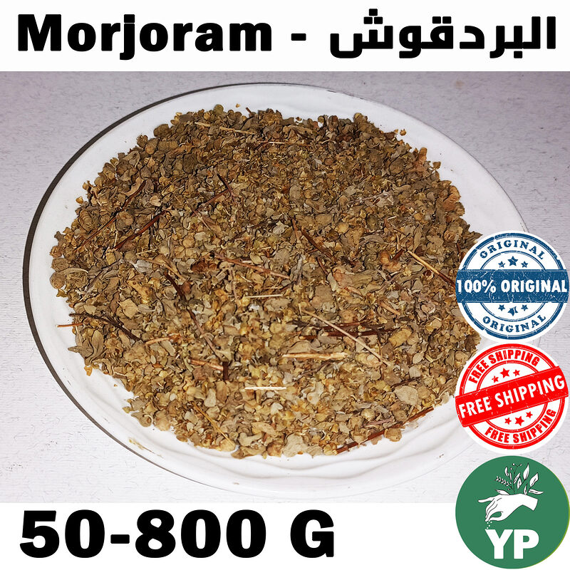 Dried marjoram leaves and stems displayed in a wooden bowl on a rustic surface with scattered whole herb sprigs