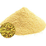 A large mound of golden-yellow fenugreek powder with a circular inset showing whole fenugreek seeds on a white background - Variation