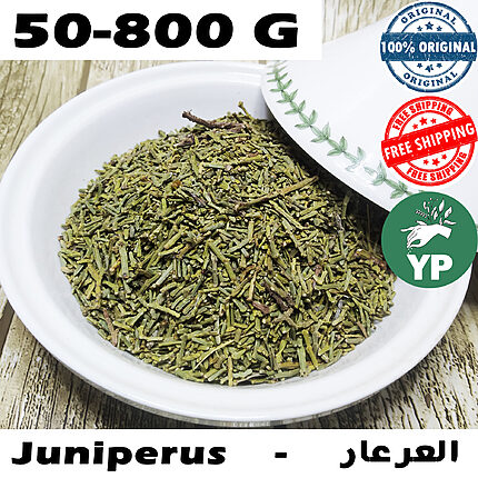 Close-up of dried green Moroccan juniperus needle leaves piled in a white ceramic bowl on a rustic wooden surface