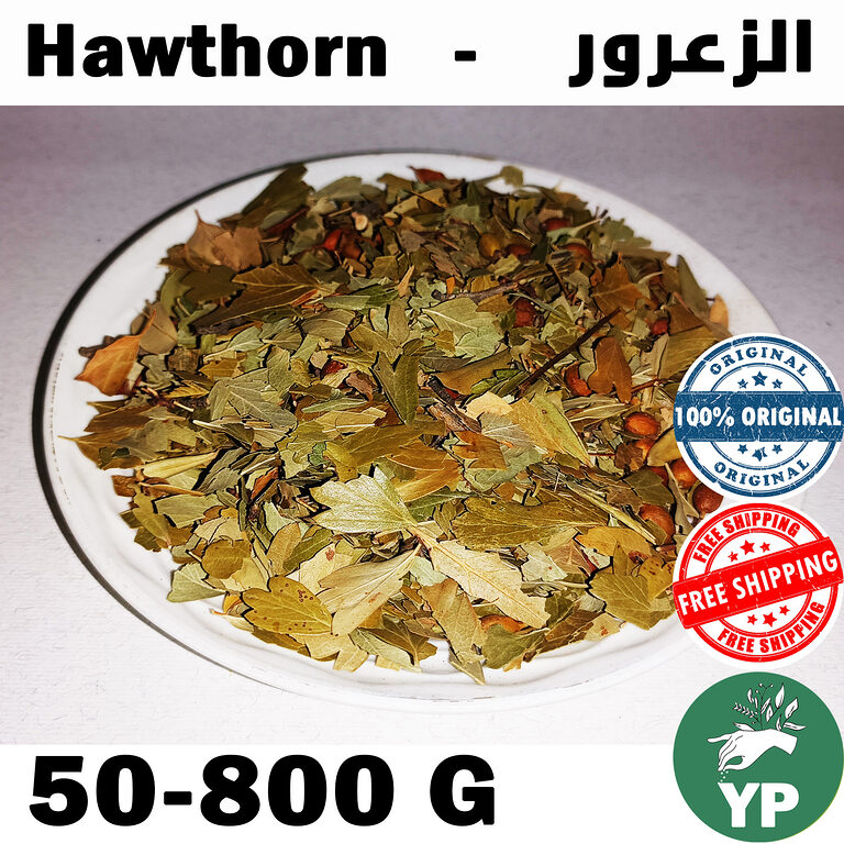Dried hawthorn leaves in shades of green and golden-brown displayed on a white round plate against a light background