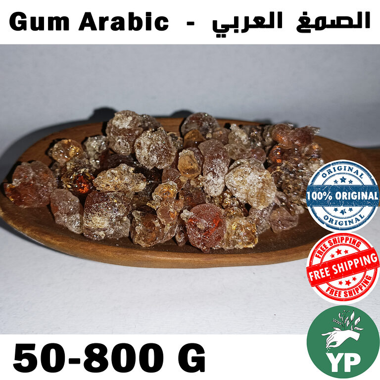 Amber and reddish-brown crystalline Gum Arabic resin pieces piled on a wooden oval dish against a light grey background