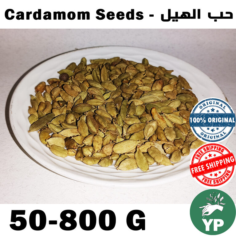 Whole green cardamom seeds (Elettaria cardamomum) piled on a white ceramic plate, showing their natural pale green color and oval pod shape